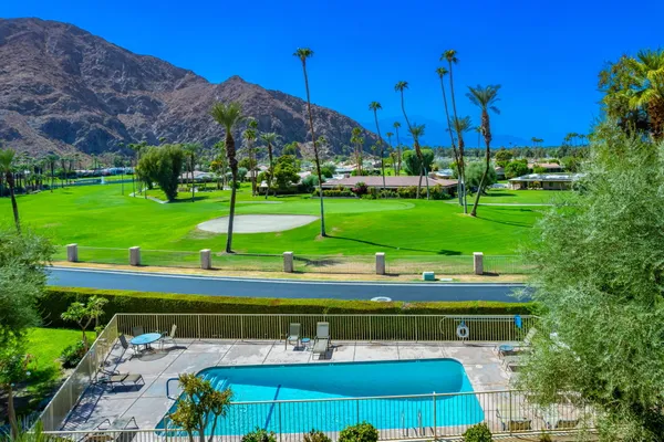 a view of a park with large trees