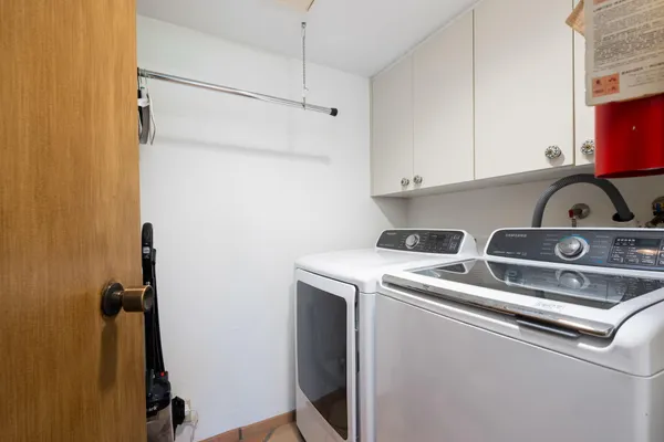 a view of storage and utility room with washer and dryer