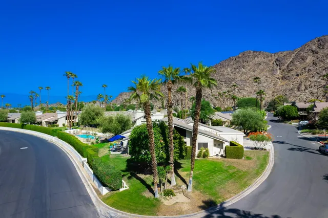 a view of a swimming pool with a yard