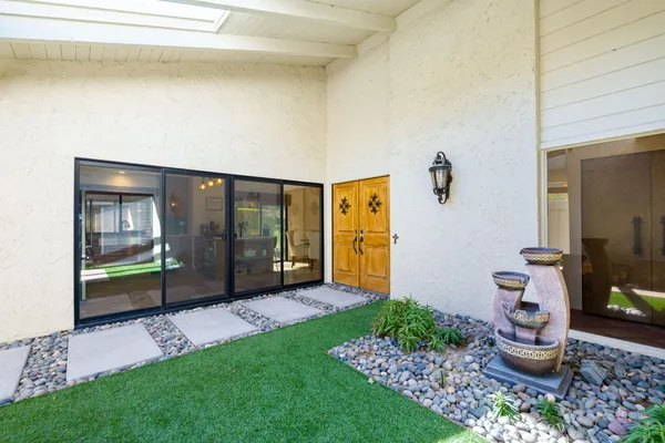 a house view with a backyard space
