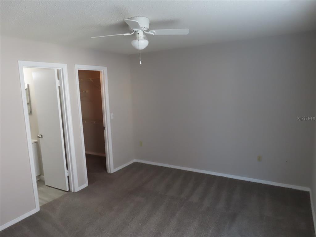 4115 Chatham Oak Court, Unit 211 Tampa, FL 33624 - Photo 12 of 21 an empty room with a fan
