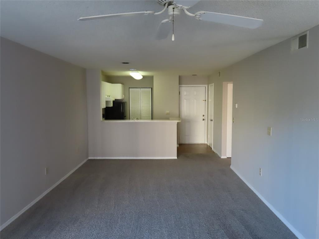 4115 Chatham Oak Court, Unit 211 Tampa, FL 33624 - Photo 16 of 21 en view interior of a house with a ceiling fan and window