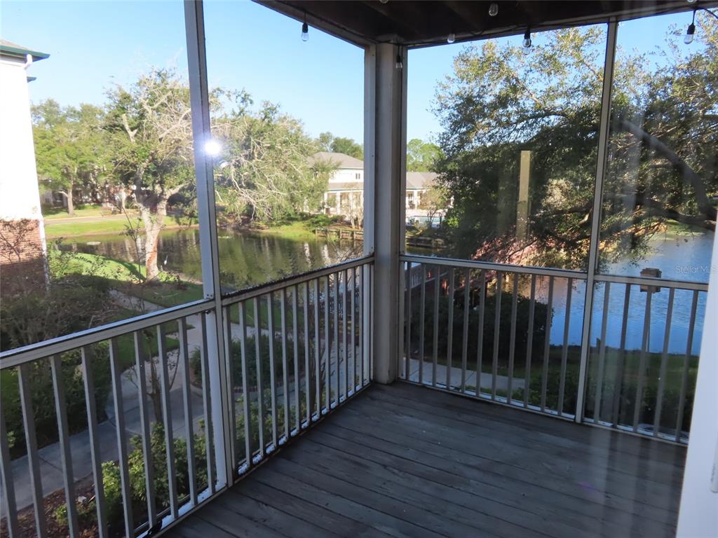 4115 Chatham Oak Court, Unit 211 Tampa, FL 33624 - Photo 20 of 21 a view of a wooden balcony