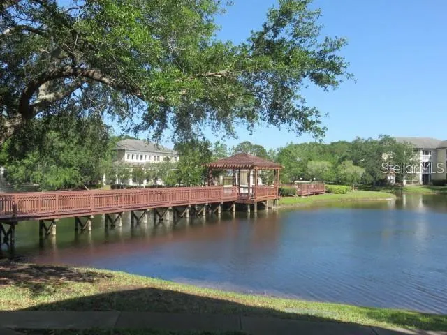 a view of a lake with a house in the background