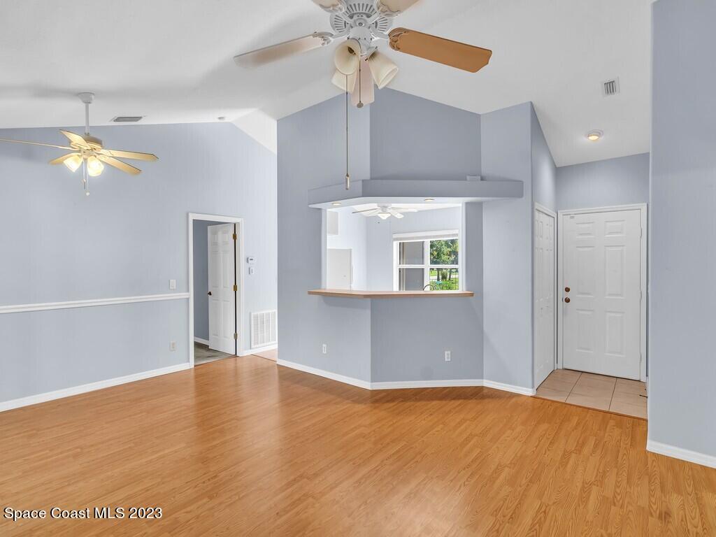 534 Sloane Street Sebastian, FL 32958 - Photo 13 of 36 wooden floor in an empty room with a window