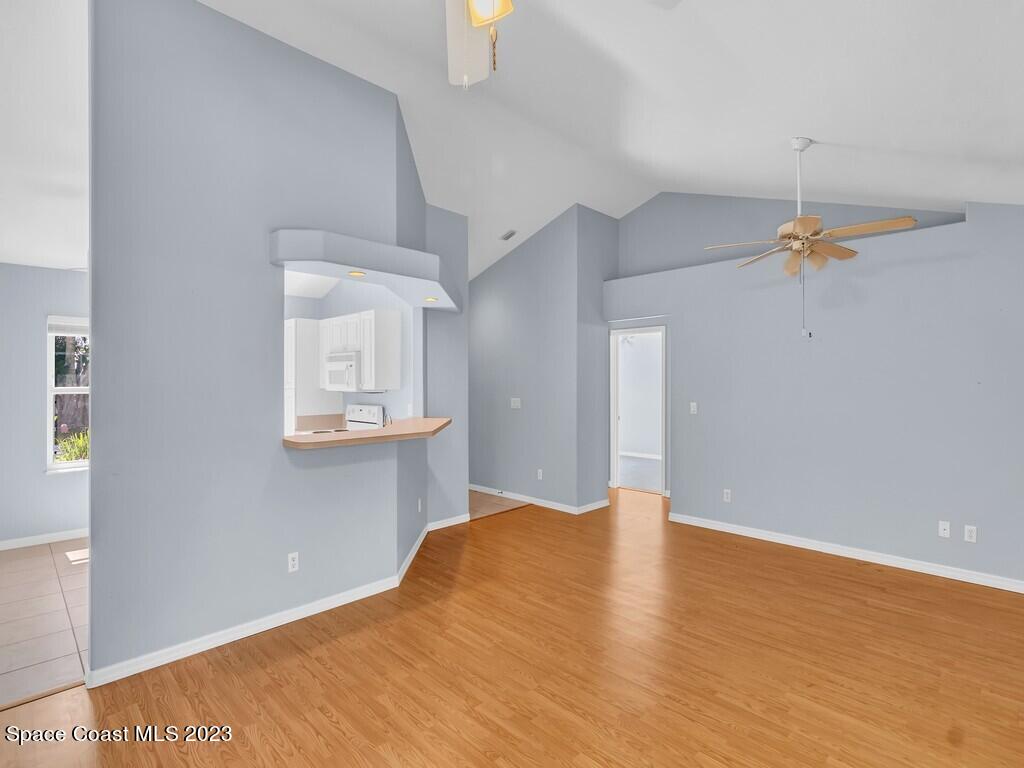 534 Sloane Street Sebastian, FL 32958 - Photo 14 of 36 a view of a room with wooden floor and staircase