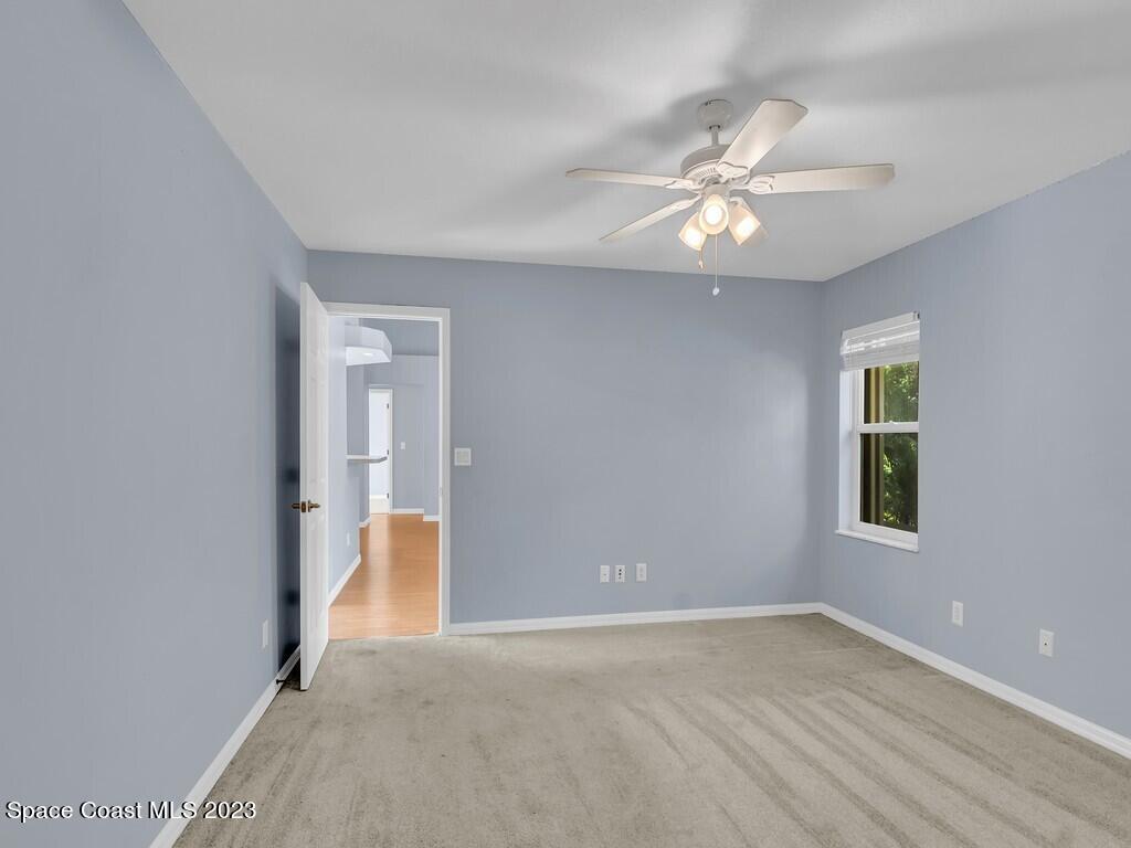 534 Sloane Street Sebastian, FL 32958 - Photo 21 of 36 wooden floor in an empty room with a window