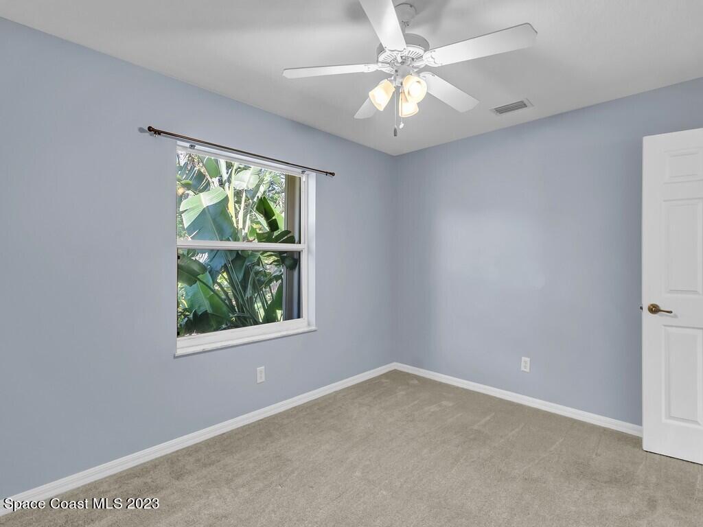 534 Sloane Street Sebastian, FL 32958 - Photo 24 of 36 an empty room with a window