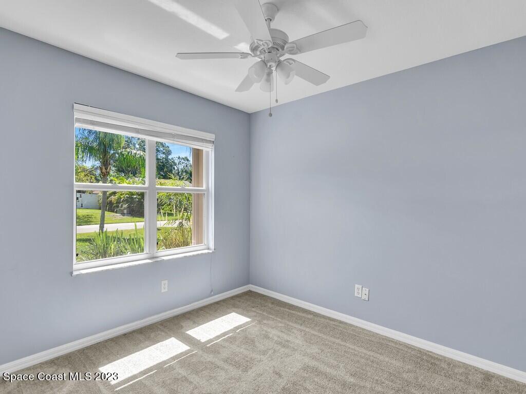 534 Sloane Street Sebastian, FL 32958 - Photo 25 of 36 an empty room with a window and a fan