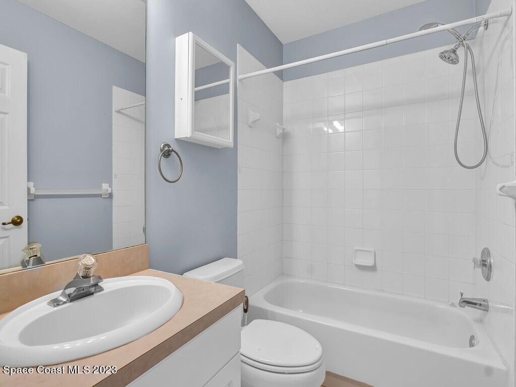 534 Sloane Street Sebastian, FL 32958 - Photo 27 of 36 a bathroom with a sink toilet and shower