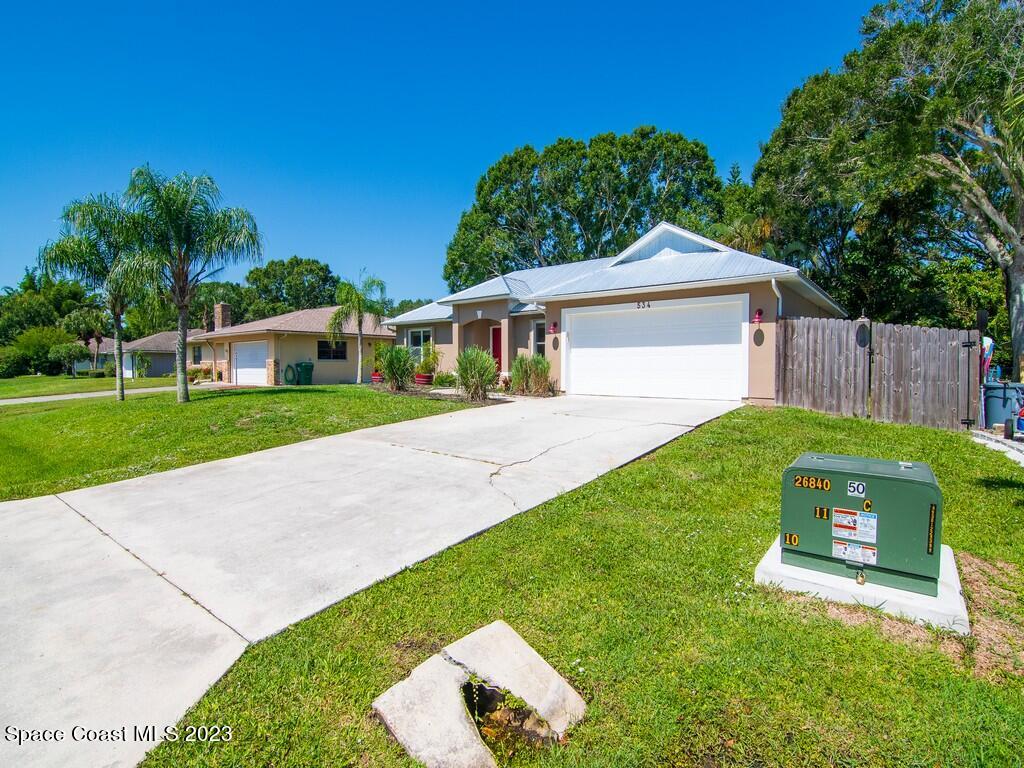 534 Sloane Street Sebastian, FL 32958 - Photo 3 of 36 a view of a house with a backyard