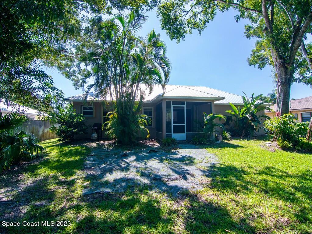 534 Sloane Street Sebastian, FL 32958 - Photo 4 of 36 a view of a house with a yard