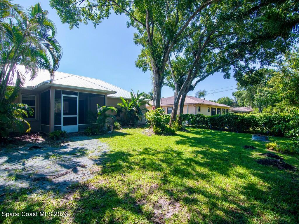 534 Sloane Street Sebastian, FL 32958 - Photo 5 of 36 a front view of a house with garden