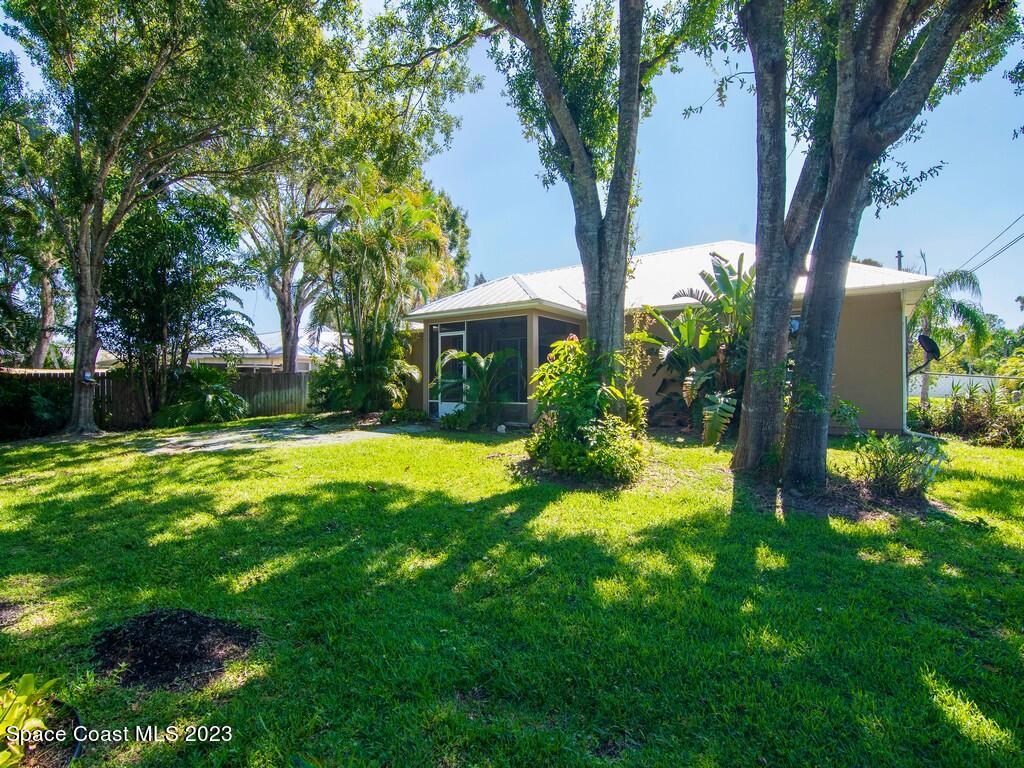 534 Sloane Street Sebastian, FL 32958 - Photo 6 of 36 a view of a house with a yard