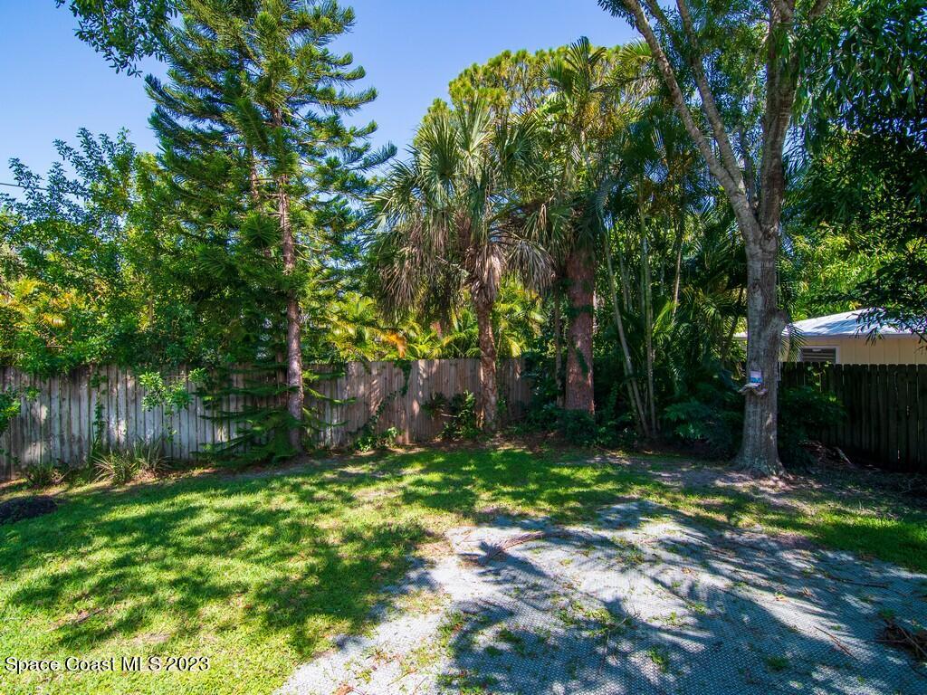 534 Sloane Street Sebastian, FL 32958 - Photo 8 of 36 a view of backyard with tree