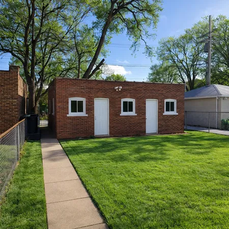 a backyard of a house with seating space