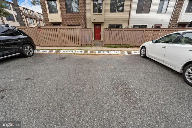 a view of street with parked cars
