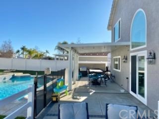 31841 Monique Circle Temecula, CA 92591 - Photo 11 of 41 a view of living room kitchen with stainless steel appliances granite countertop furniture and stove