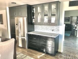 31841 Monique Circle Temecula, CA 92591 - Photo 22 of 41 a kitchen with stainless steel appliances kitchen island granite countertop a refrigerator and a sink