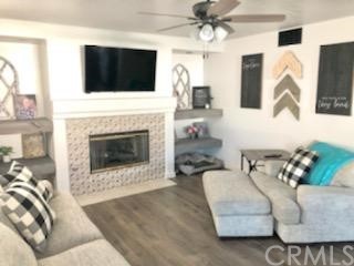 31841 Monique Circle Temecula, CA 92591 - Photo 24 of 41 a living room with furniture a flat screen tv and a fireplace