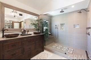 31841 Monique Circle Temecula, CA 92591 - Photo 32 of 41 a bathroom with a double vanity sink mirror and shower