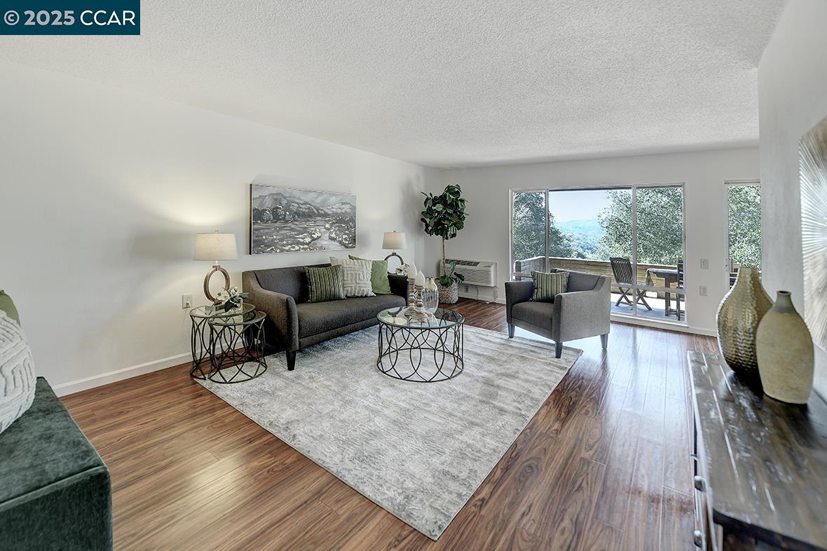 1268 Skycrest Drive, Unit 4 Walnut Creek, CA 94595 - Photo 1 of 50 a living room with furniture and a table