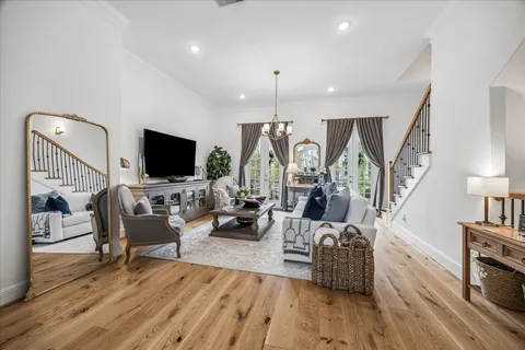 a living room with fireplace furniture and a flat screen tv