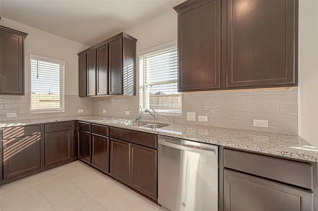 a kitchen with a stove and a microwave