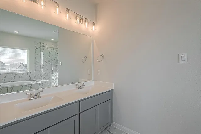 a bathroom with a sink and a shower