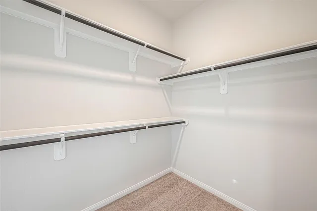 a front view of a house with a large window