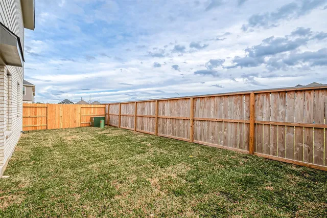 a view of garage and yard