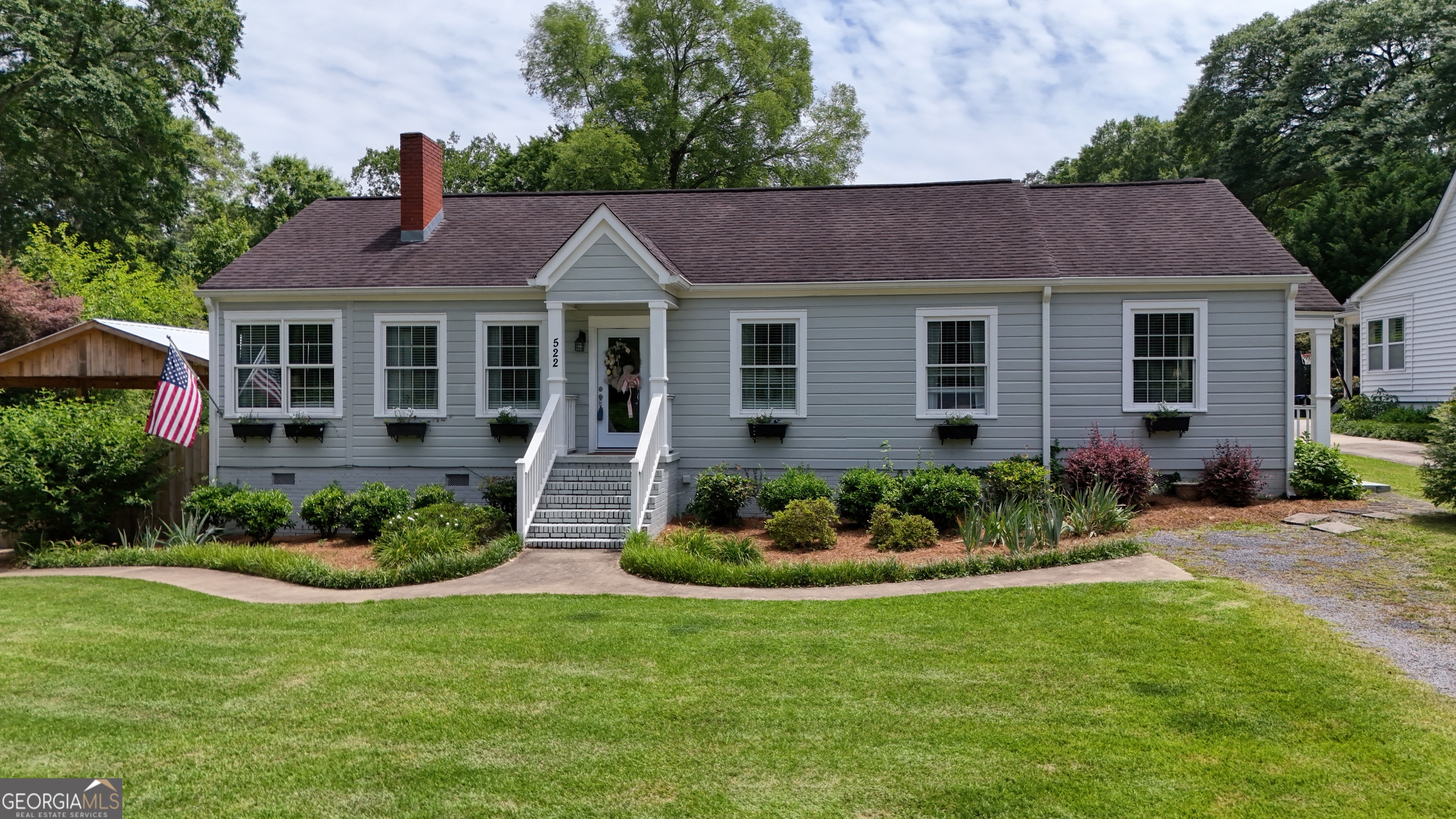 522 East 8th Street Southeast Rome, GA 30161 - Photo 1 of 1 a front view of a house with a garden