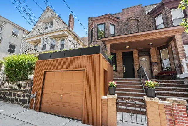 a view of a building with entryway and stairs