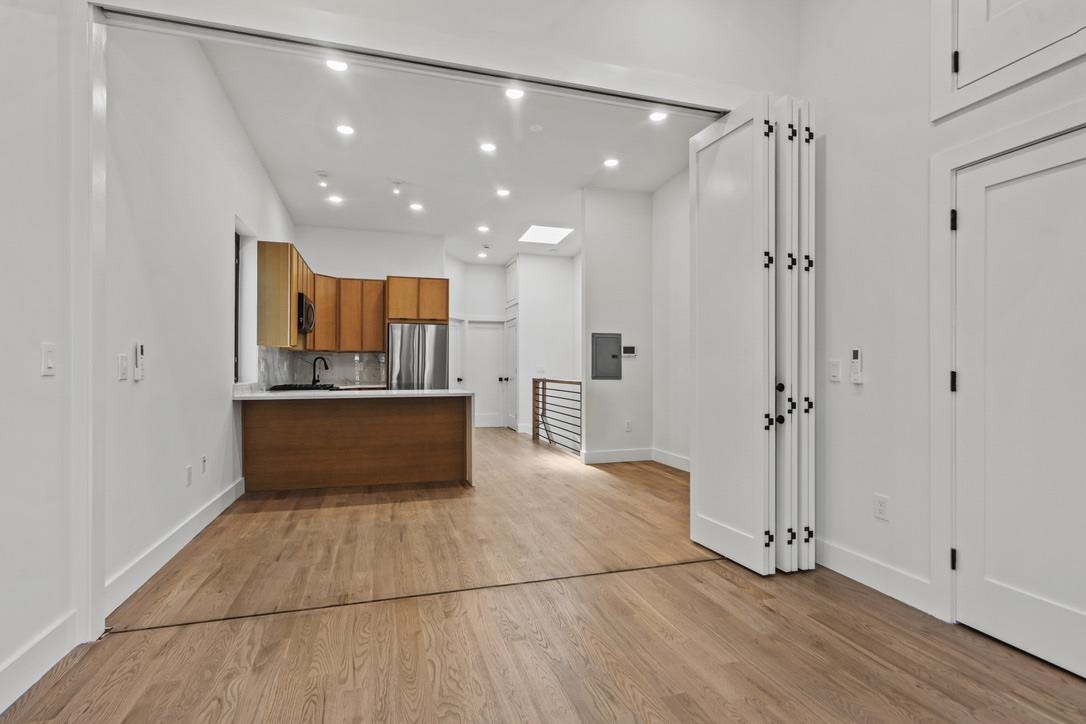 41 47th Street, Unit 2 Weehawken, NJ 07086 - Photo 17 of 22 a view of kitchen with refrigerator and window