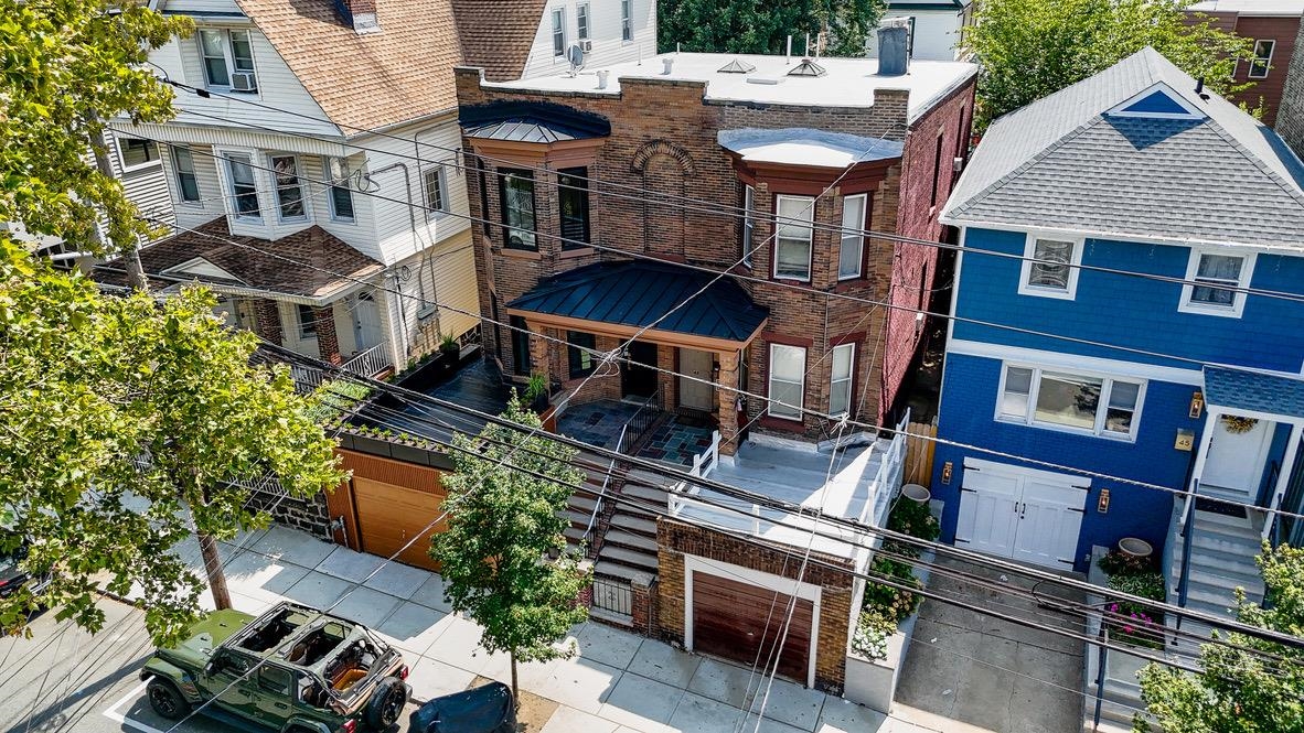 41 47th Street, Unit 2 Weehawken, NJ 07086 - Photo 2 of 22 an aerial view of a house with a yard