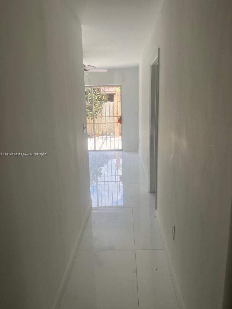 3637 Southwest 14th Street, Unit 2 Miami, FL 33145 - Photo 2 of 9 a view of an empty room with a window