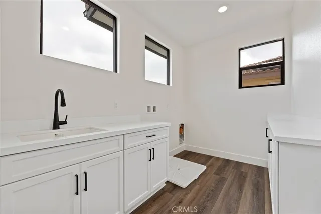 a kitchen with a sink and a window