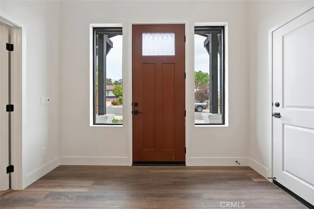 an empty room with windows and closet