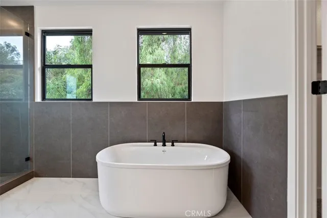 a white bath tub sitting in a bathroom
