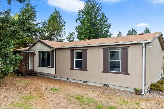 a view of house with yard
