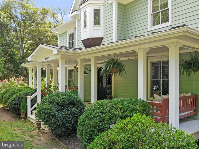 front view of a brick house with a large windows