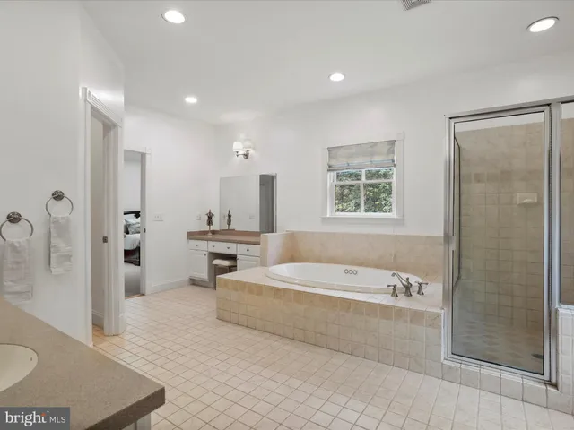 a view of a chair and table on the garden