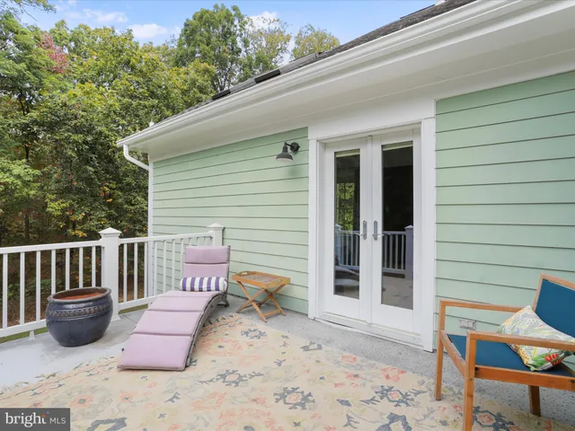 a view of a lake with large trees