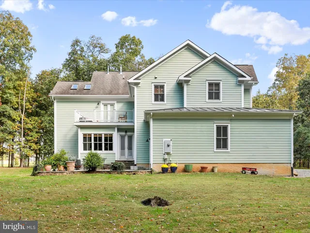 an aerial view of a house with a garden