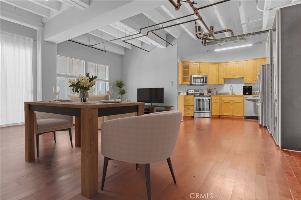 312 West 5th Street, Unit 1109 Los Angeles, CA 90013 - Photo 2 of 47 a living room with furniture and a flat screen tv