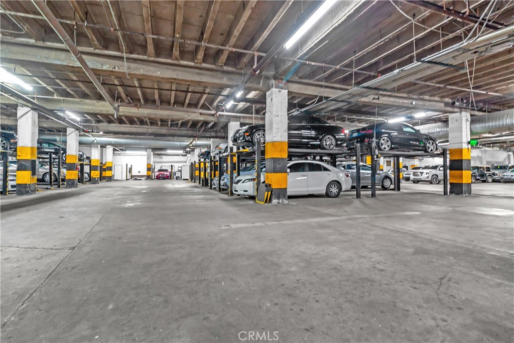 312 West 5th Street, Unit 1109 Los Angeles, CA 90013 - Photo 39 of 47 a view of parking garage with cars
