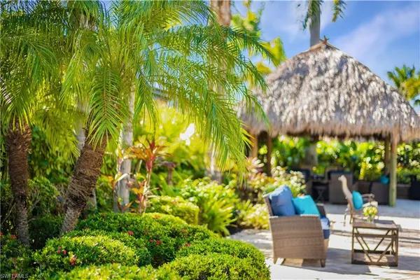 a view of a chairs and tables in the patio