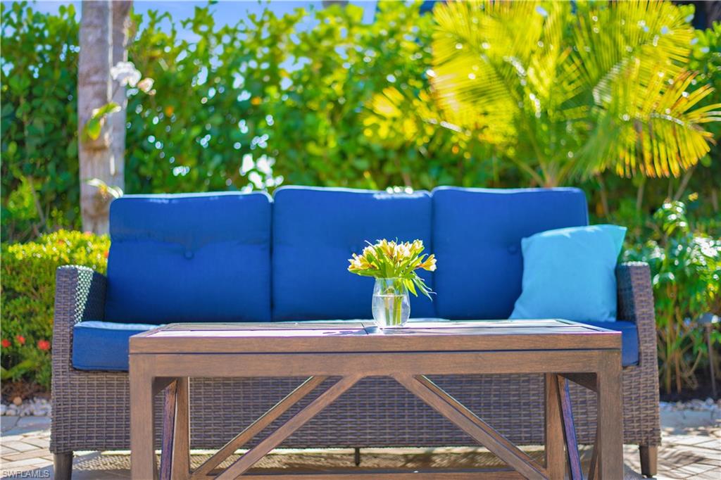 13553 Snapper Lane Naples, FL 34114 - Photo 5 of 24 a view of a chairs and table in the backyard