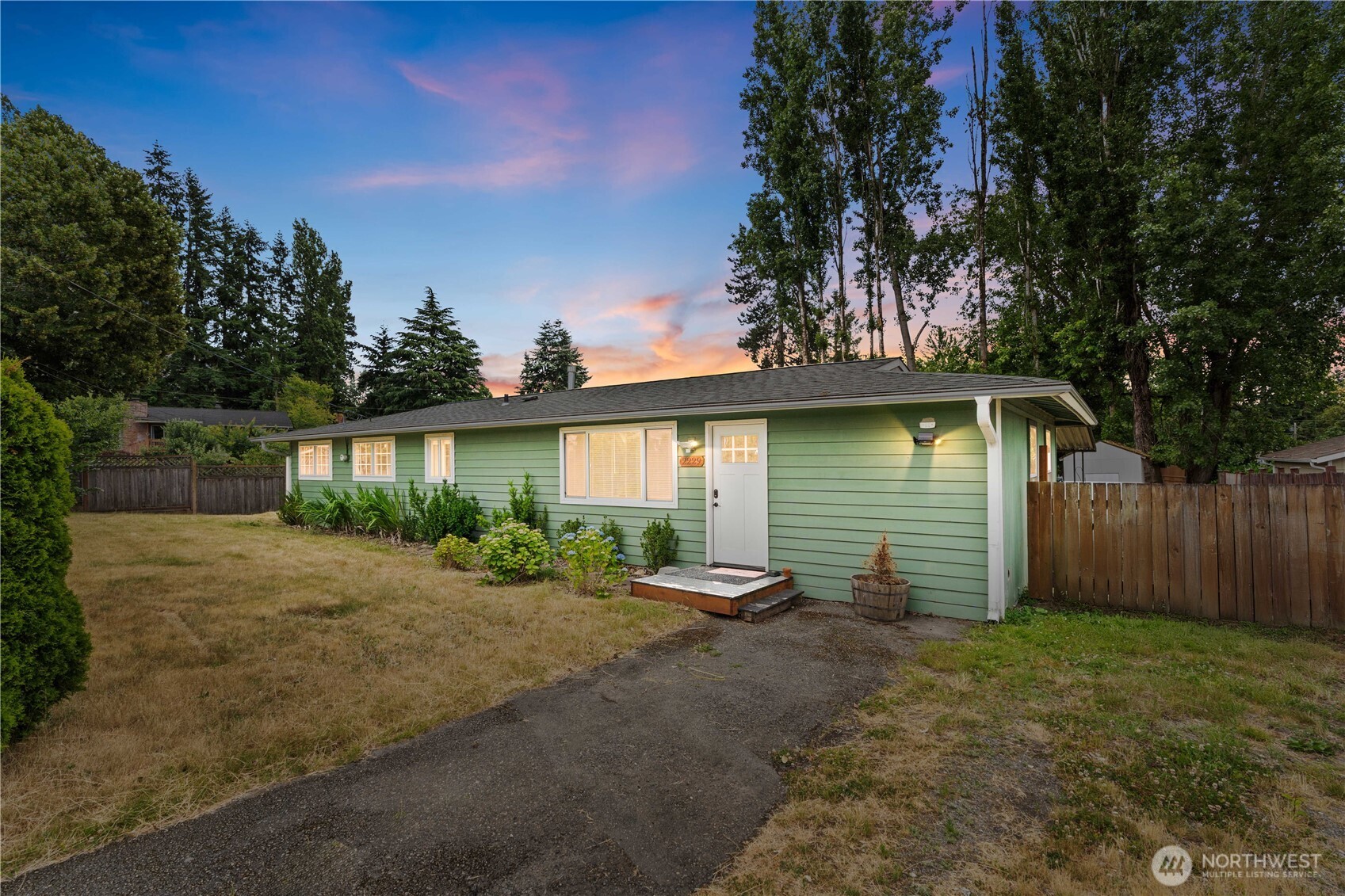 a view of a backyard of the house