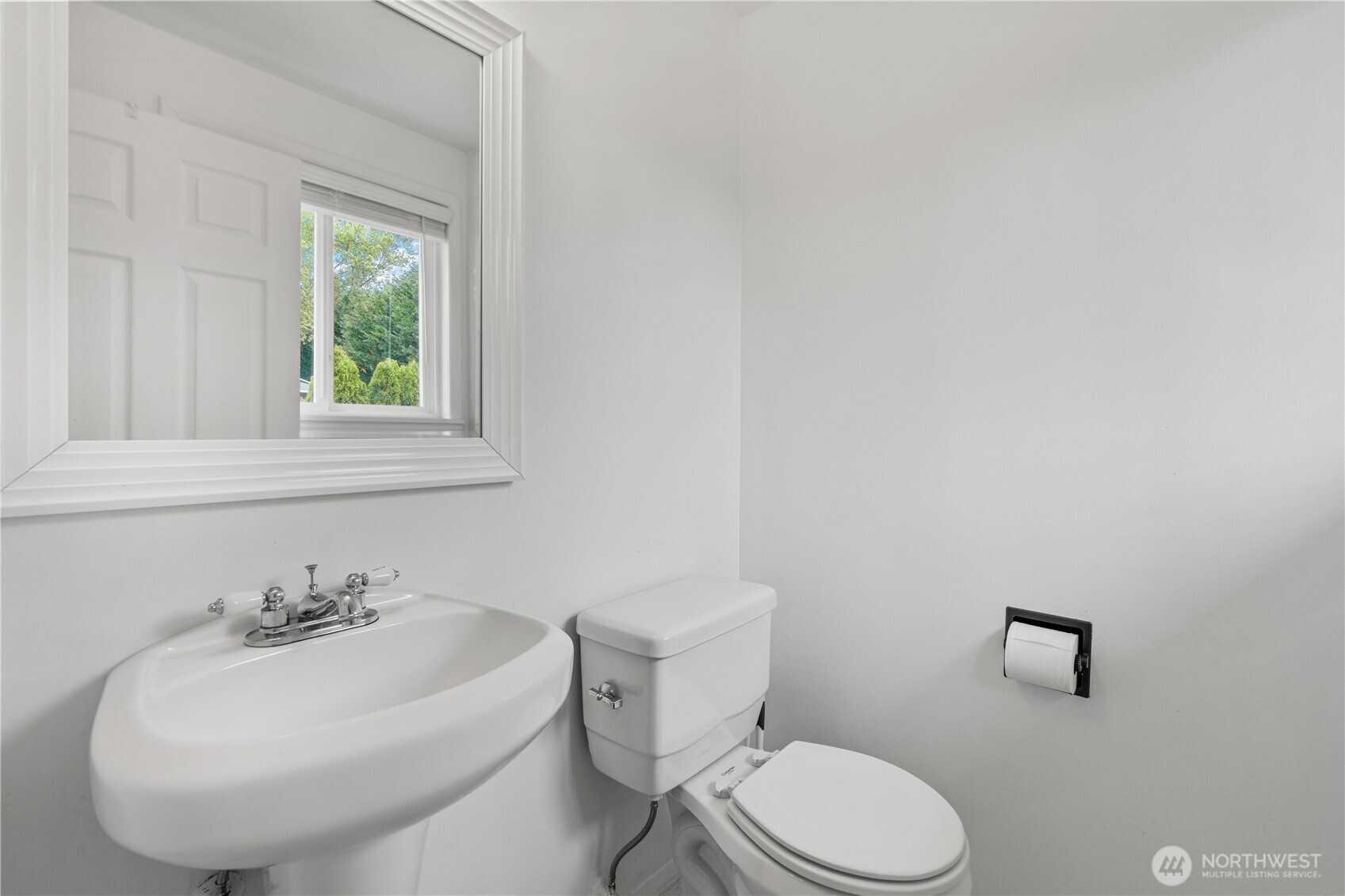 2229 Southwest 330th Street Federal Way, WA 98023 - Photo 21 of 30 a bathroom with a sink a toilet and mirror